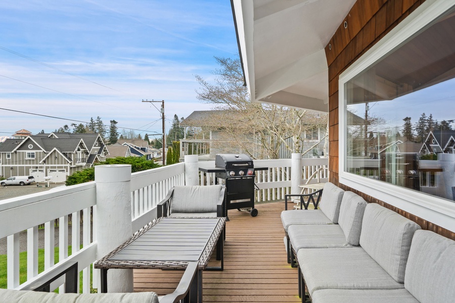 Your private deck offers the perfect spot for morning coffee and sunset barbecues, with comfortable seating overlooking the quiet neighborhood.