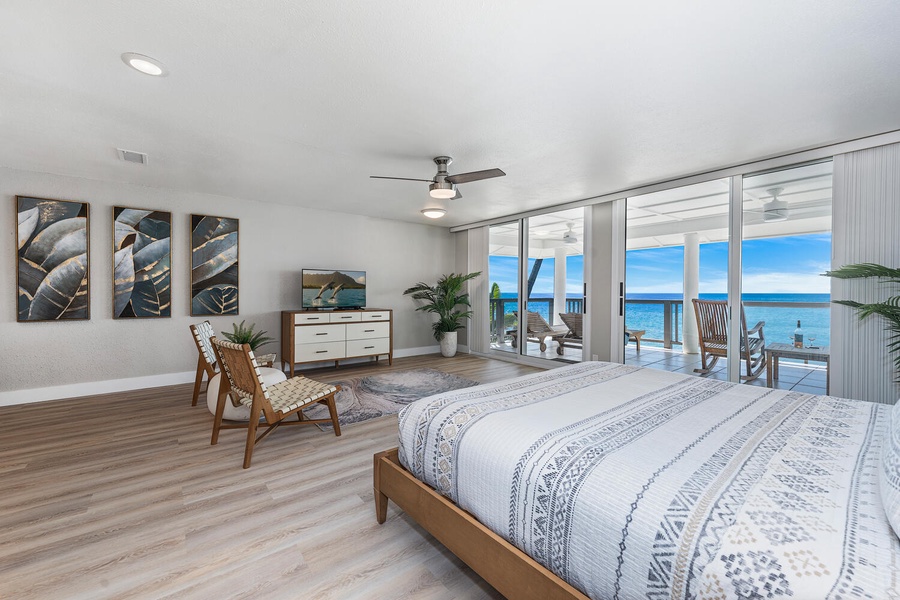 Expansive primary suite with king bed, ocean views, and access to the private lanai.