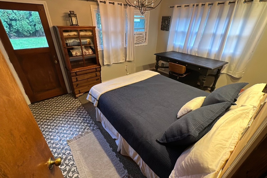 In the garage, you will find a 4th bedroom complete with a queen bed and private entrance to the back yard, making it the perfect spot for anyone desiring more privacy but just slightly away from the main house activities.