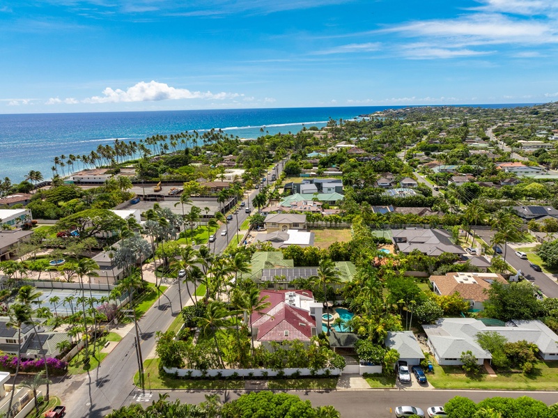 Aerial view showcasing the coastal neighborhood with views extending to the beautiful Hawaiian shoreline.