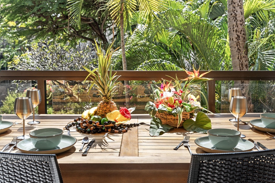 Outdoor dining setup with tropical greenery and vibrant decor.