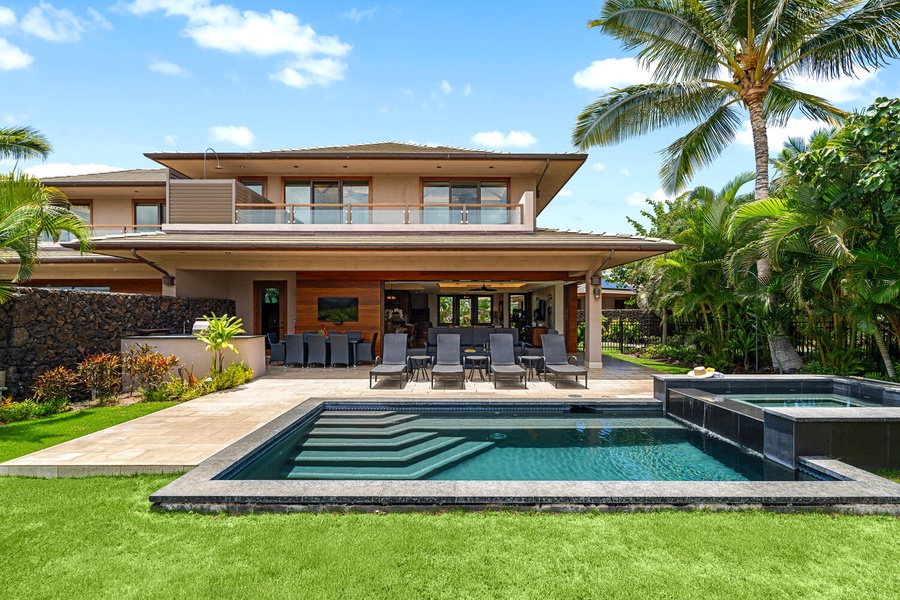 Backyard oasis with pool, spa, and spacious lawn overlooking the fairway.