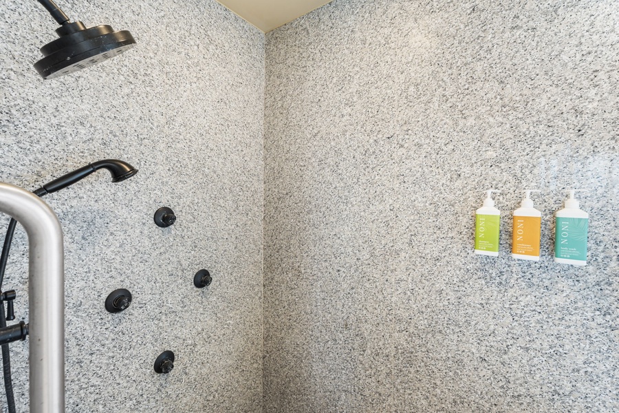 Indulge in your private spa-like shower with luxurious rainfall head, body jets, and premium amenities for the ultimate relaxation experience.