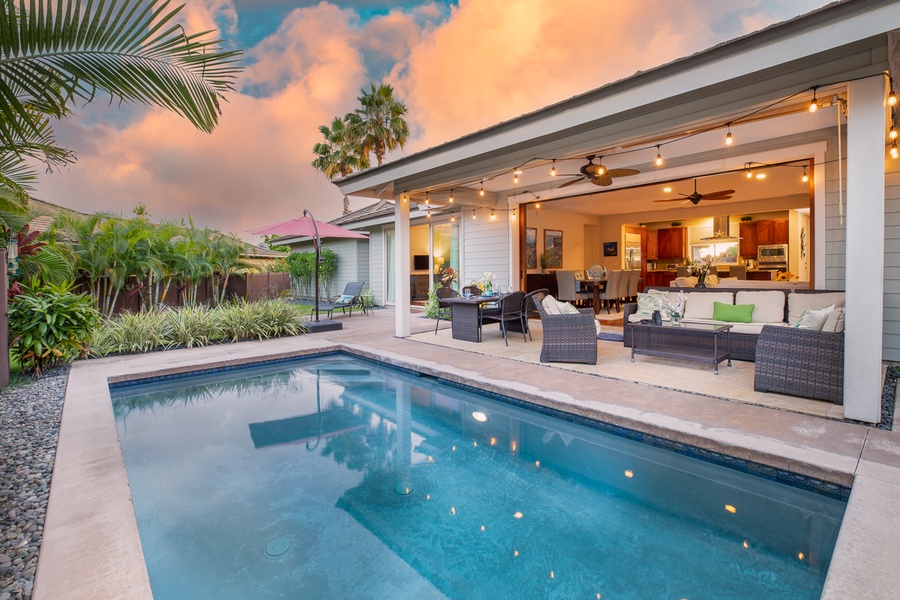 Huge pocket doors in the great room open to a covered lanai, the perfect setting for a morning cup of coffee, an afternoon nap, or an open-air dinner.