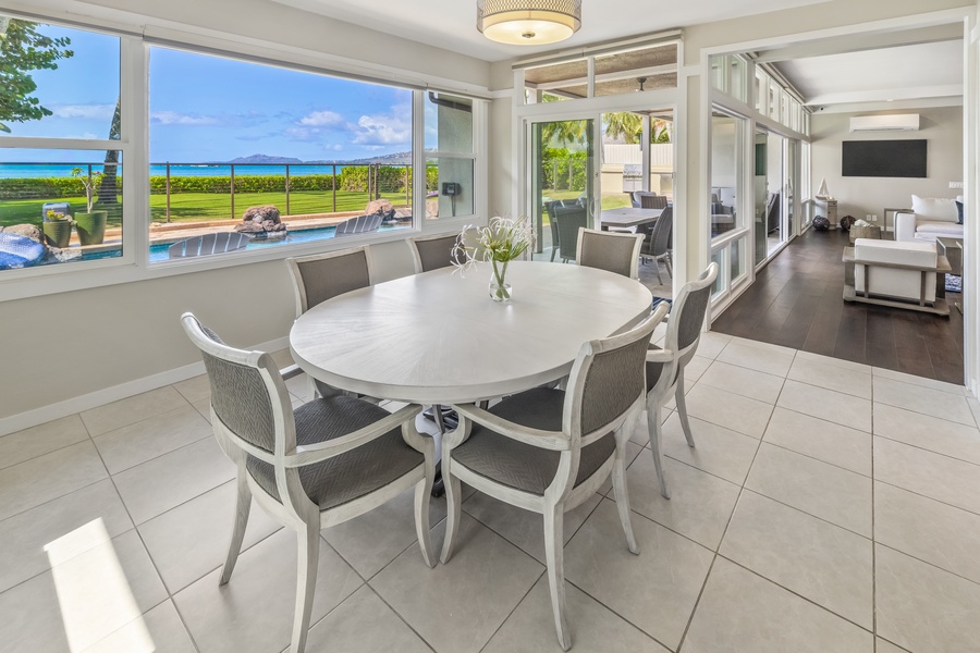 Charming breakfast nook with pool and ocean views, perfect for casual dining.