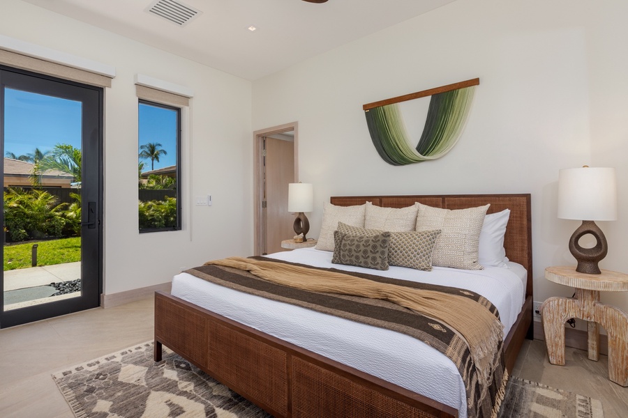 This inviting bedroom perfectly balances modern elegance and comfort, featuring a stylish wooden bed complemented by earth-toned bedding.