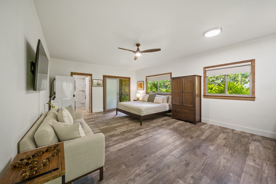 Detached studio suite with king bed, lounge seating, kitchenette, and private bath—a serene private escape.