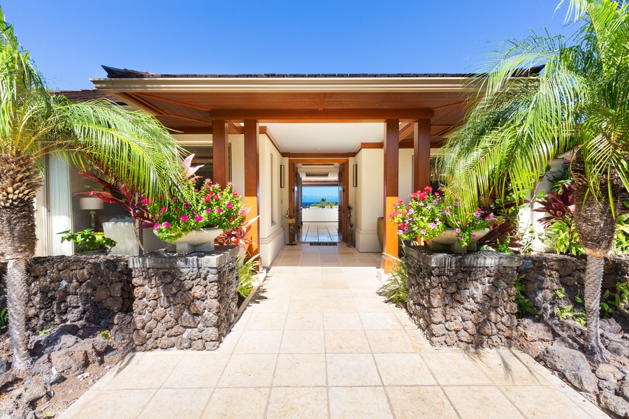 Elegant front entrance with vibrant landscaping