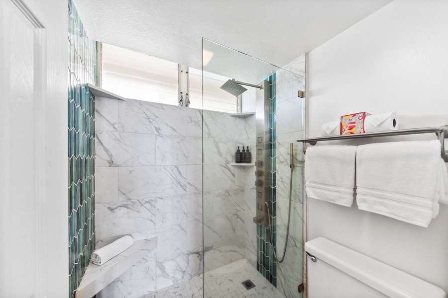 Refresh in Royal Kahana 308’s walk-in shower with sleek tile, custom details, and rainfall flow.