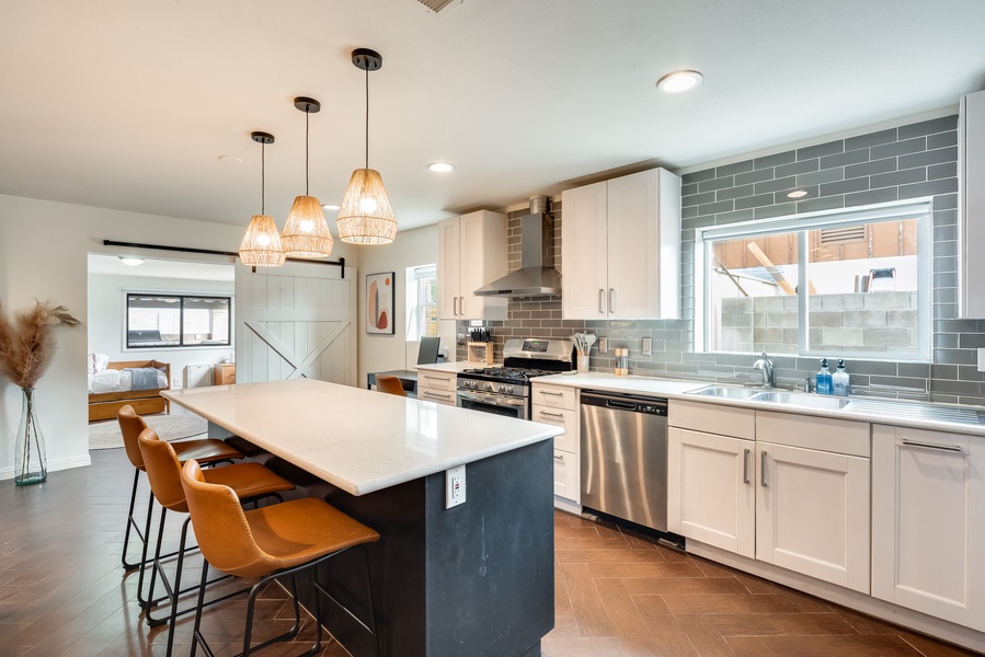 The kitchen is well stocked and overlooks the pool