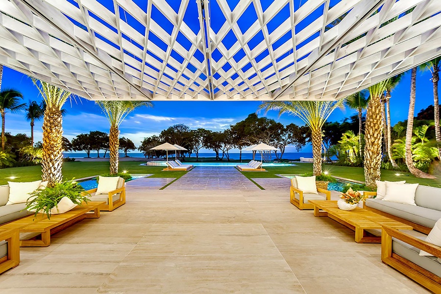 Enjoy the stunning view from the patio overlooking the pool and ocean.