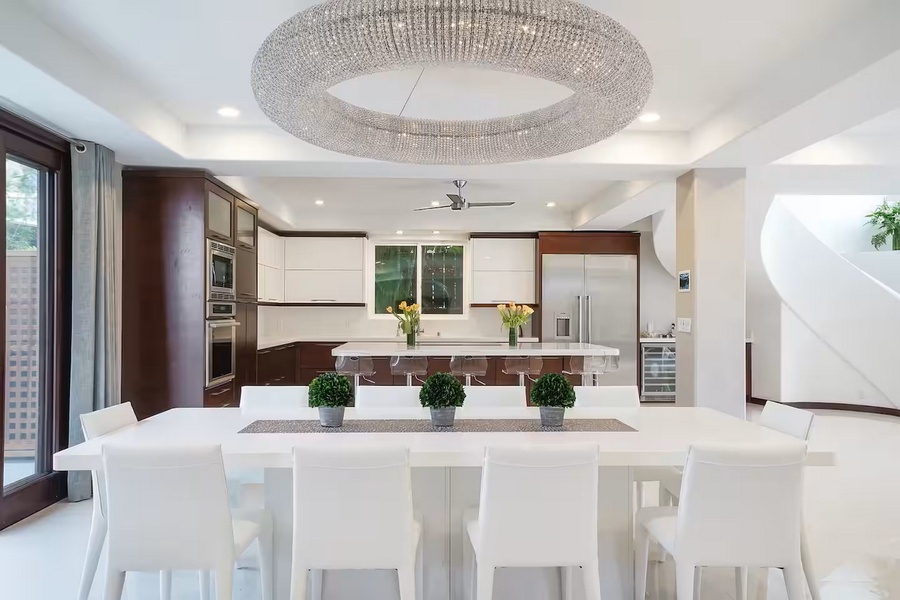Bar seating wraps the island, keeping the cook in the conversation.