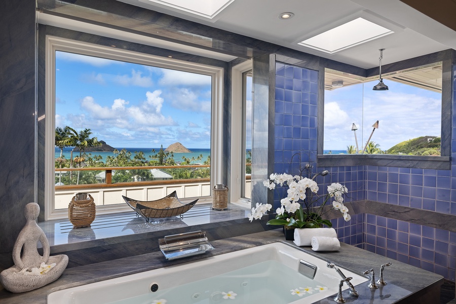 The primary suite soaking tub and walk-in shower.