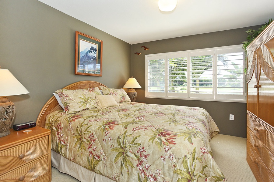 The primary guest bedroom is comfortable and spacious for a restful slumber.