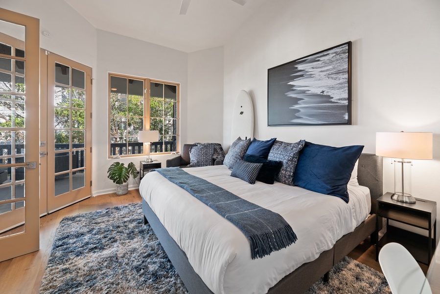 French doors provide a private entry to this king bedroom with blinds on all windows for privacy.  Perfect for someone who prefers a large bedroom on the same floor as the entry, kitchen, dining and living areas.