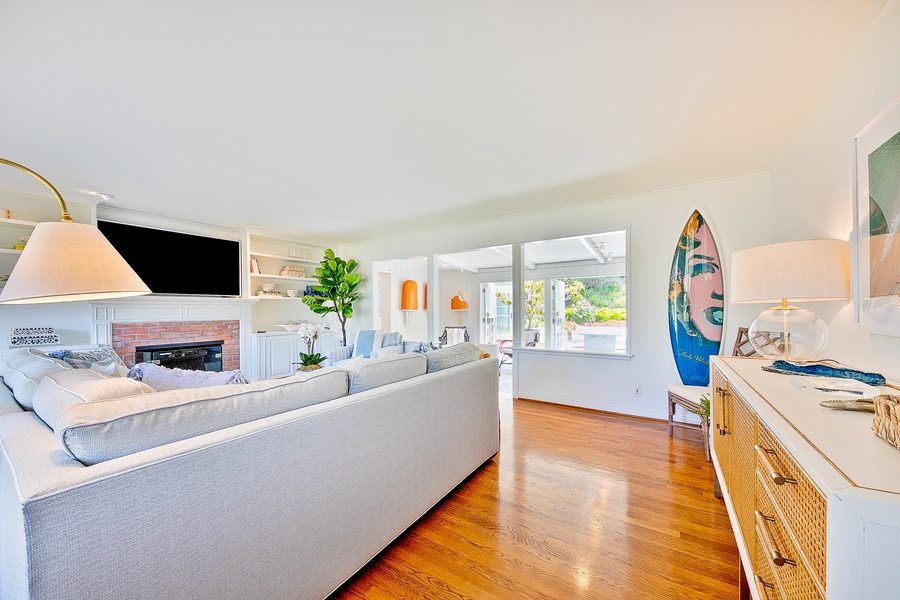 Living room from front door (showing Warhol surfboard)