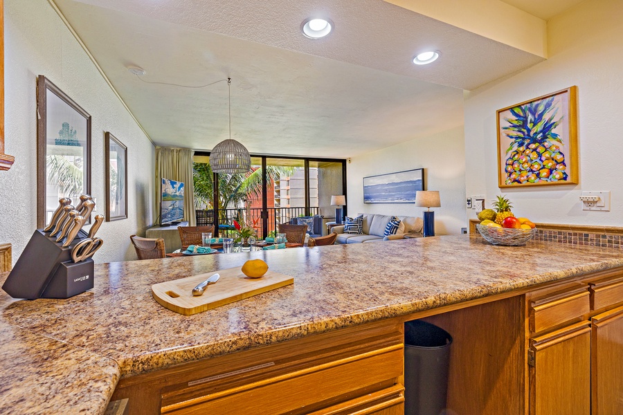 Kaanapali Shores 544’s open-concept kitchen flows into the cozy living space, perfect for entertaining.
