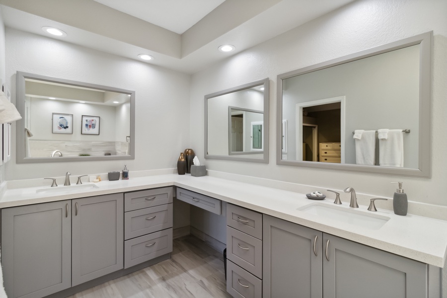 The redesigned primary bath features double sinks and a fabulous walk-in shower, making your morning routine a breeze