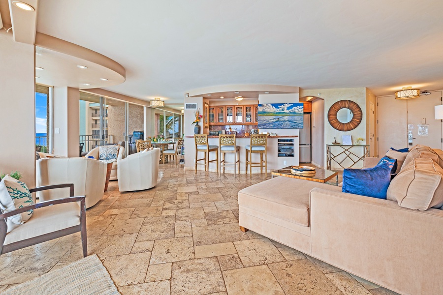 The spacious layout of Royal Kahana 610 includes a bar seating area and plenty of room for gathering, making it ideal for entertaining guests.