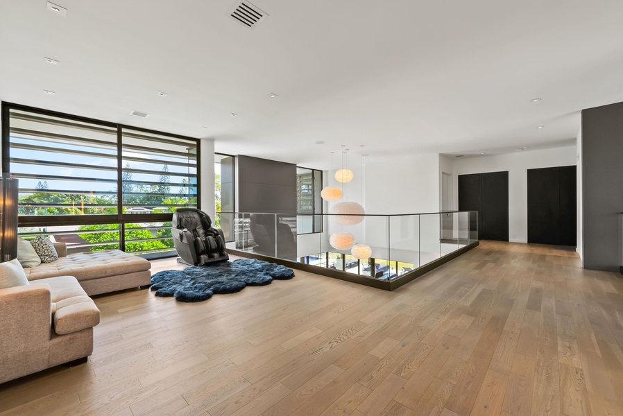 Soothing neutral tones and minimalist textures create a restful landing zone just outside the primary suite.