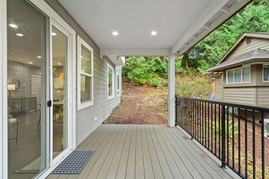 Step onto your lanai where morning coffee tastes better surrounded by peaceful forest views.