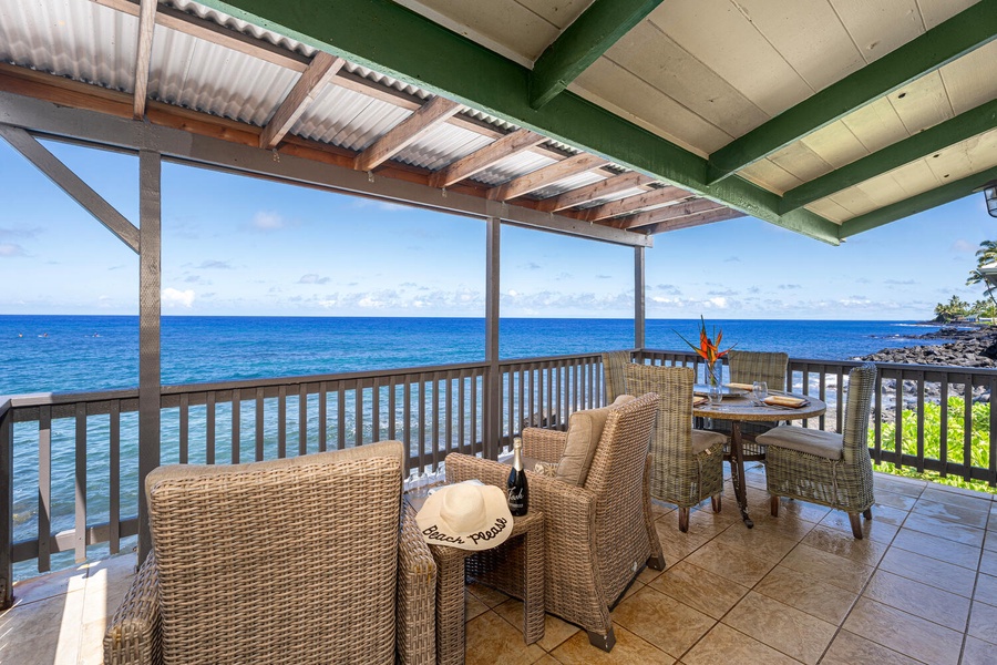 Lanai stretches along the home, offering multiple spaces to dine, lounge, and watch the waves.