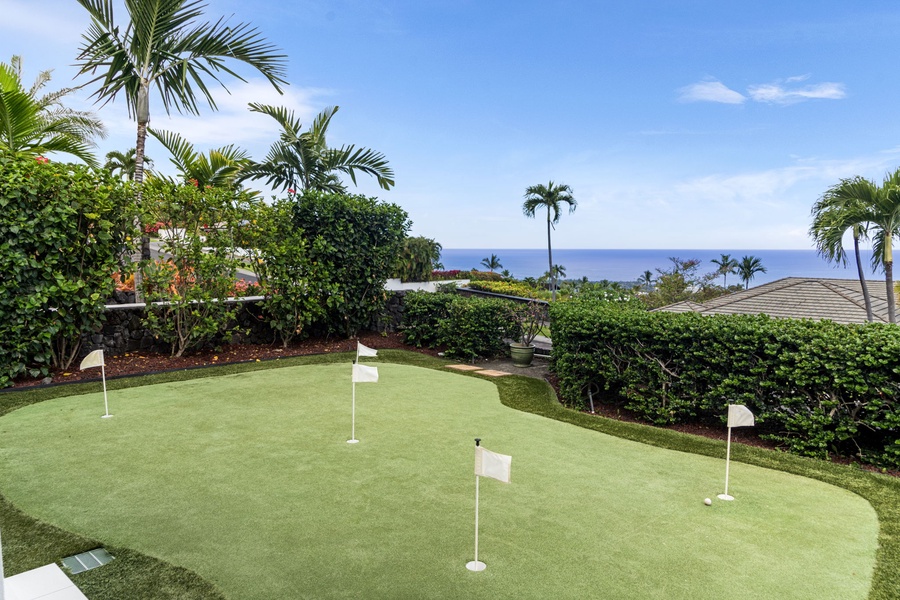 Ocean-view putting green invites fun and friendly competition under sunny skies.