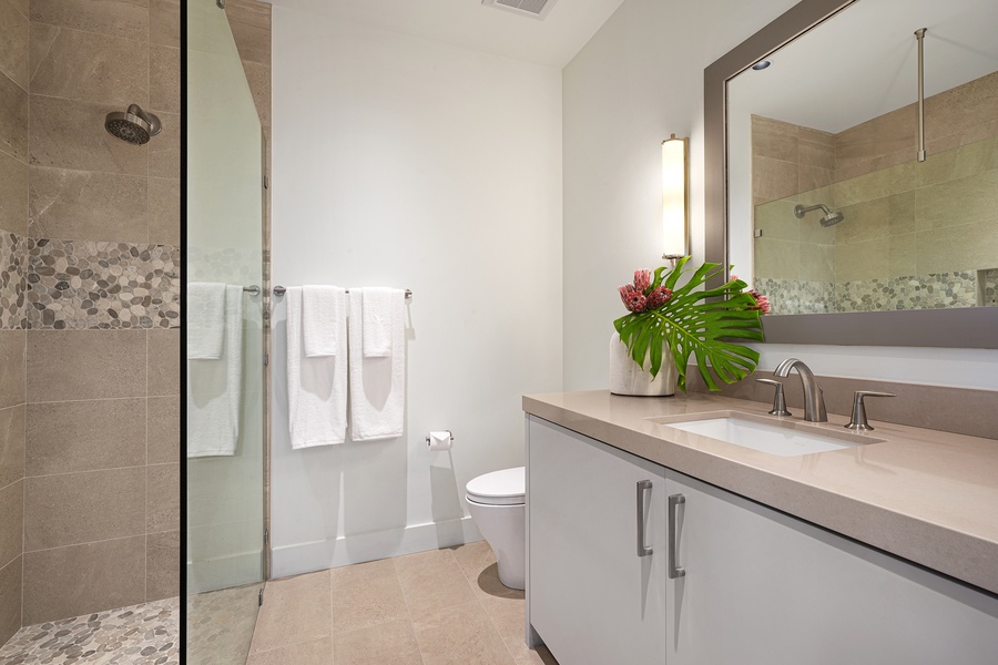 Step into a contemporary bathroom designed with sophistication, offering a calm and inviting space.