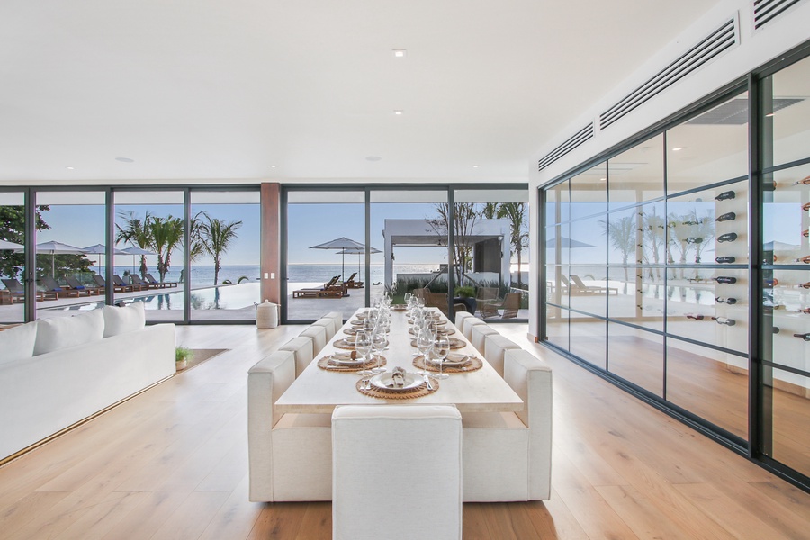 Dine at a large table with a stunning view of the ocean.