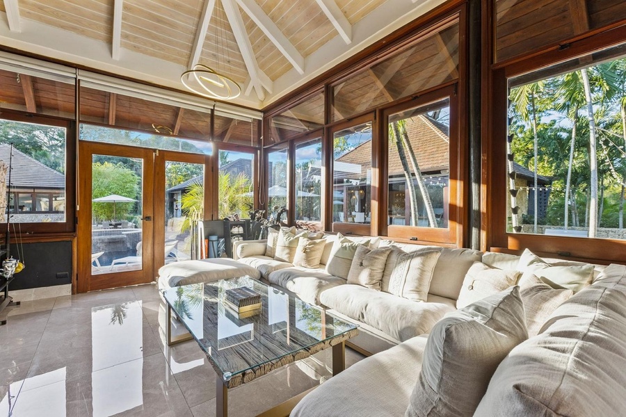 The second living area with cozy seating and access to a serene outdoor space.