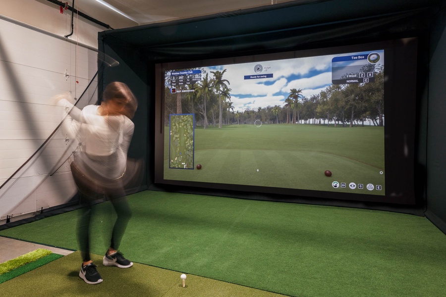 Work on your golf swing in the golf simulator room.