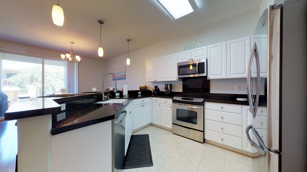 The kitchen is equipped with stainless steel appliances for your culinary adventurs.