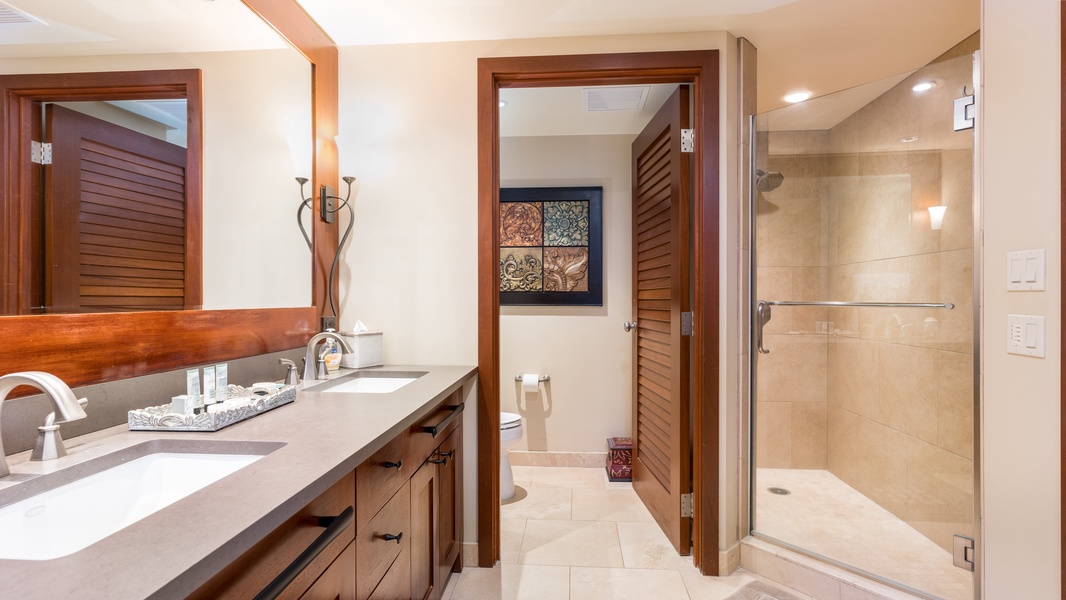 The primary bath also offers a walk- in shower and expansive vanity.