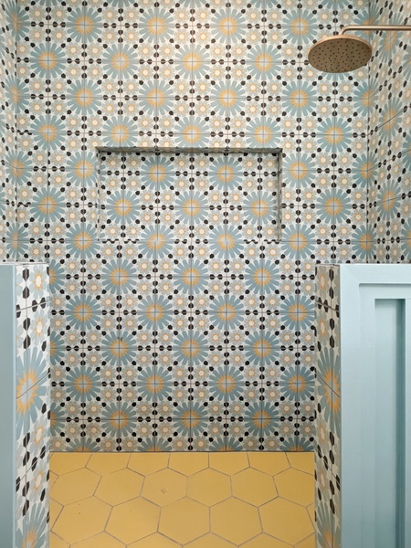 Step into your stylish shower with stunning geometric tiles and sleek fixtures for a refreshing start to each day.