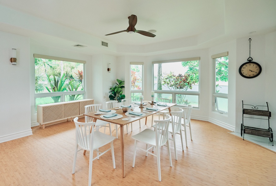 You'll love sharing meals in this bright dining space, surrounded by lush garden views through every window.