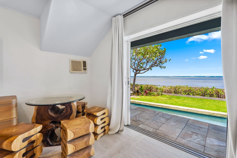 Wake up to ocean breezes and coastal views from this open-air retreat corner.