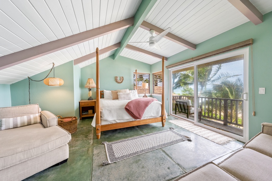 Tropical paradise in your airy bedroom, where exposed beams meet mint walls and ocean breezes flow through sliding doors to your private balcony.