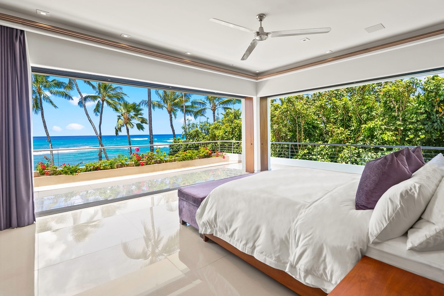 Wake up to stunning ocean views framed by swaying palms and vibrant tropical gardens. Your peaceful retreat opens to a private terrace where paradise awaits.
