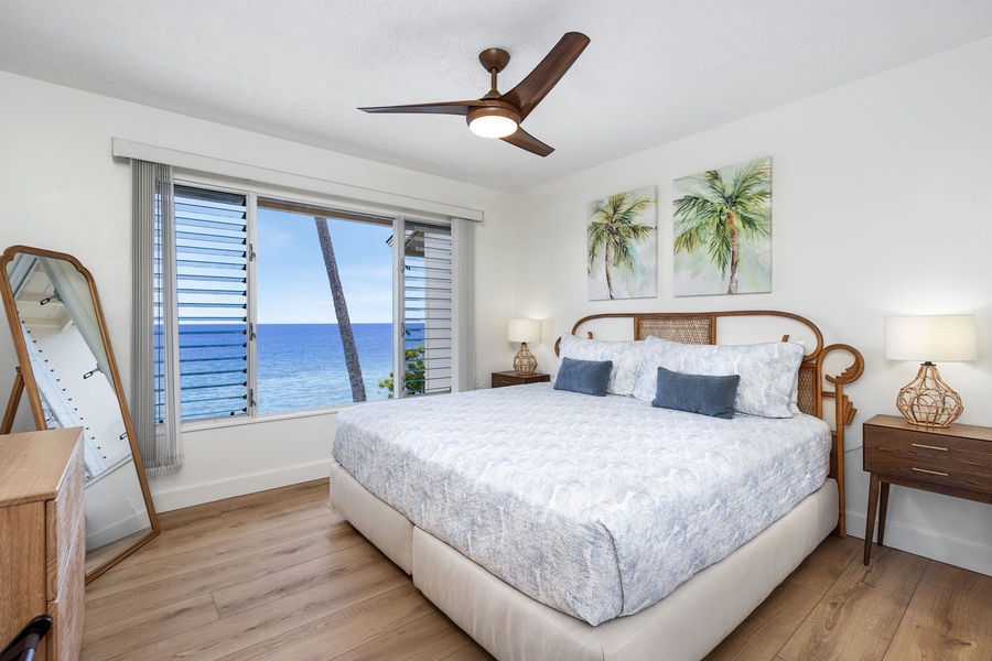 Wake up to panoramic Pacific views from the primary bedroom with a plush king-size bed.