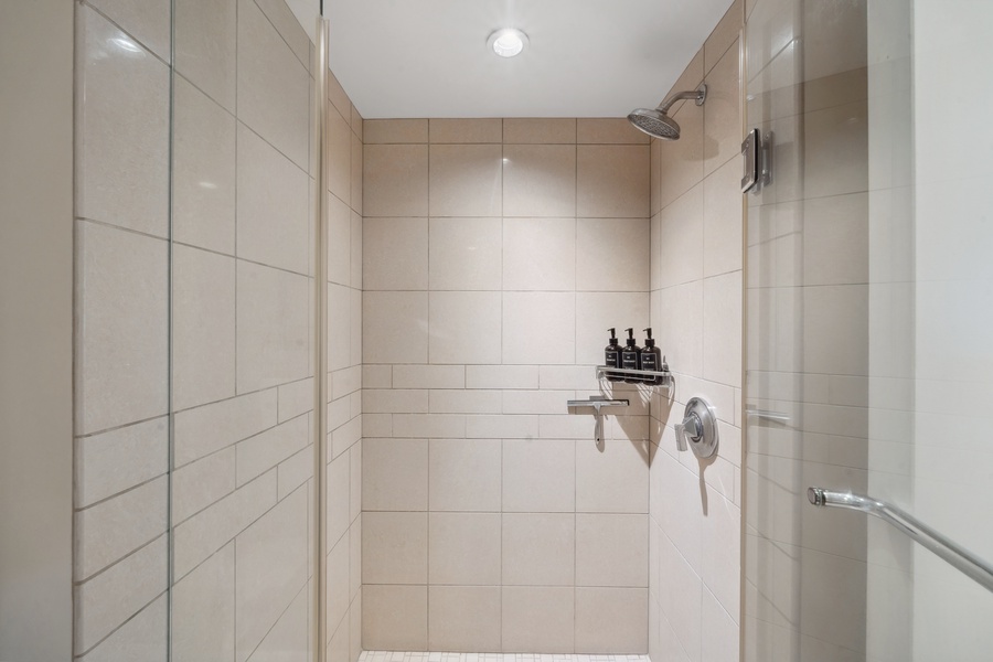 Refresh and recharge in the glass walk-in shower at Honua Kai Konea 204, with tile and modern finishes.