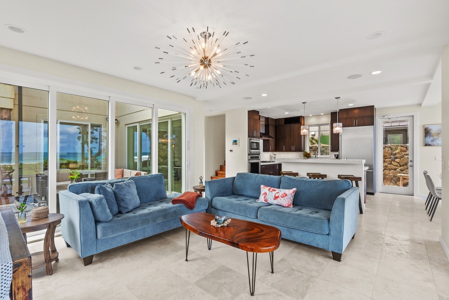 Relax in the open living area with comfortable seating and easy access to the kitchen.