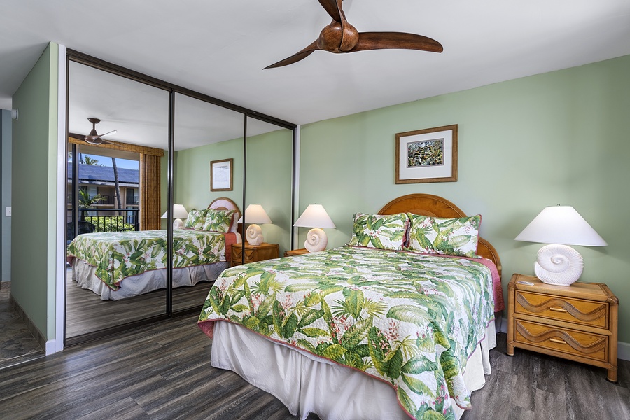Quest bedroom offers window A/C, Lanai access, and a bathroom steps from the entry door