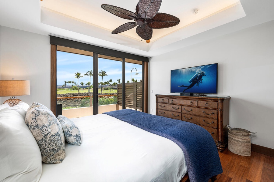 Elegant guest room with calming views and a large flatscreen TV.