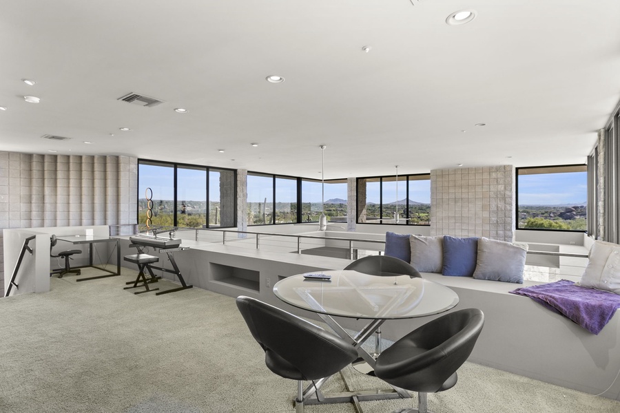 Open and airy lounge area designed for creativity and focus, enveloped by panoramic views.
