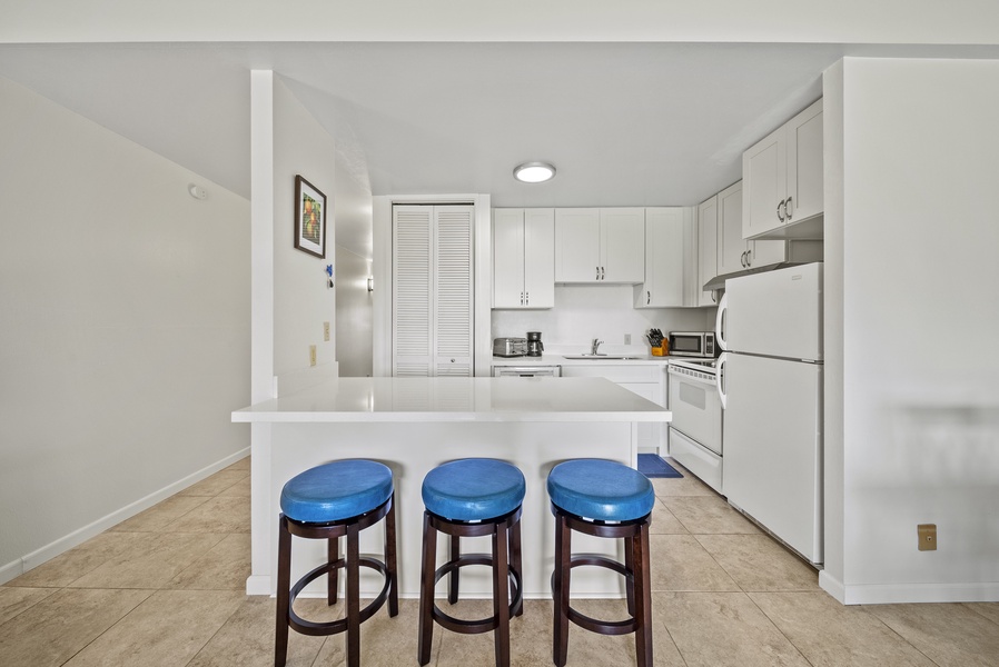 The fully stocked kitchen has top-tier appliances.