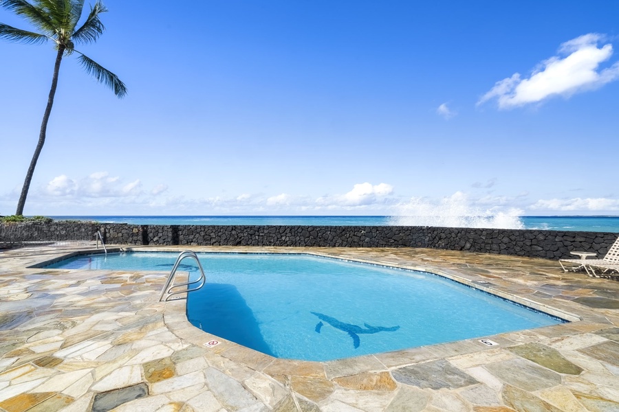 Resort-style pool sits oceanside—perfect for sunbathing and cooling off with postcard-perfect views.