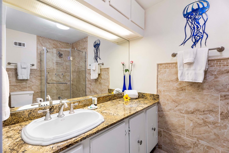 Shared bathroom with ample vanity space