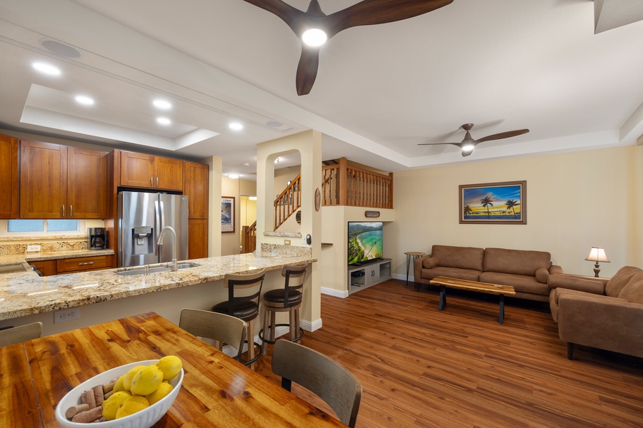 Enjoy a meal at the breakfast bar with seating for four, overlooking the open living space.