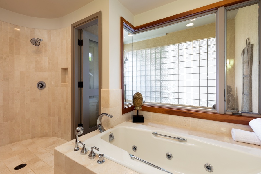 Unwind in your private spa-style bathroom with a luxurious jetted tub and spacious walk-in shower.
