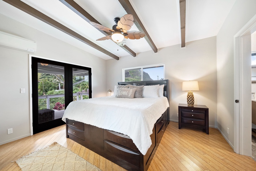 Primary bedroom with king bed, ceiling fan and split A/C